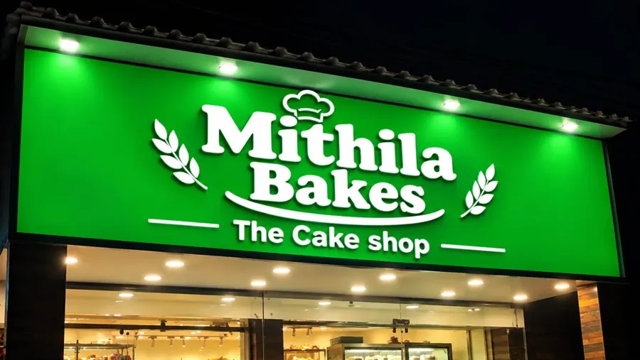 Mithila Bakes shop front with its green signboard at night